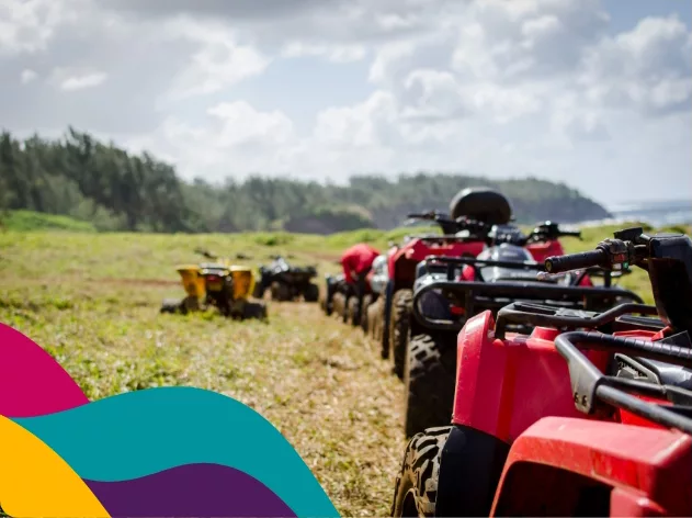 A line of red quad bikes waits for an adventure in Mauritius.